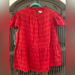 Vibrant red eyelet top with peplum